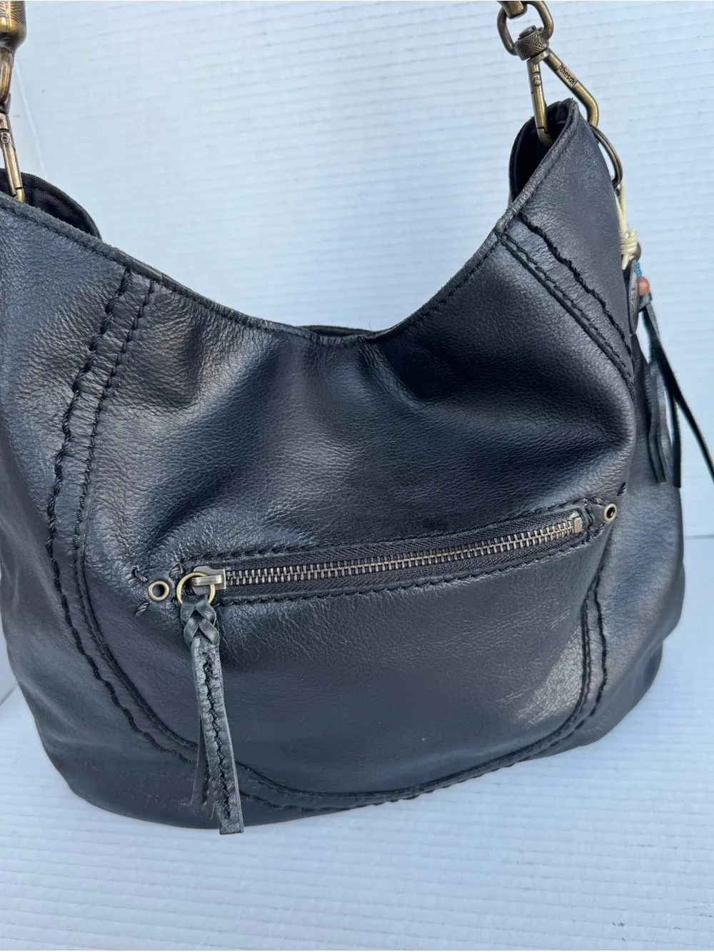 The Sak Black Leather Hobo Bag Braided Strap & Tassel Charm